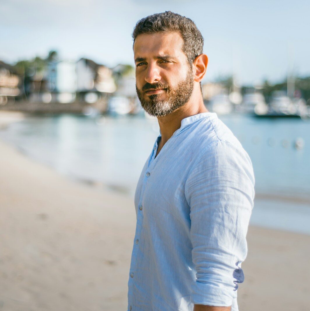 man standing on beach during daytime